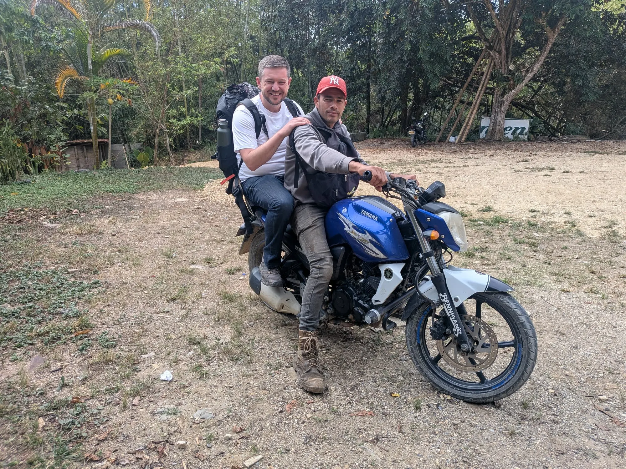 Ross with Jhon Fredy and his moto before the mountain crossing