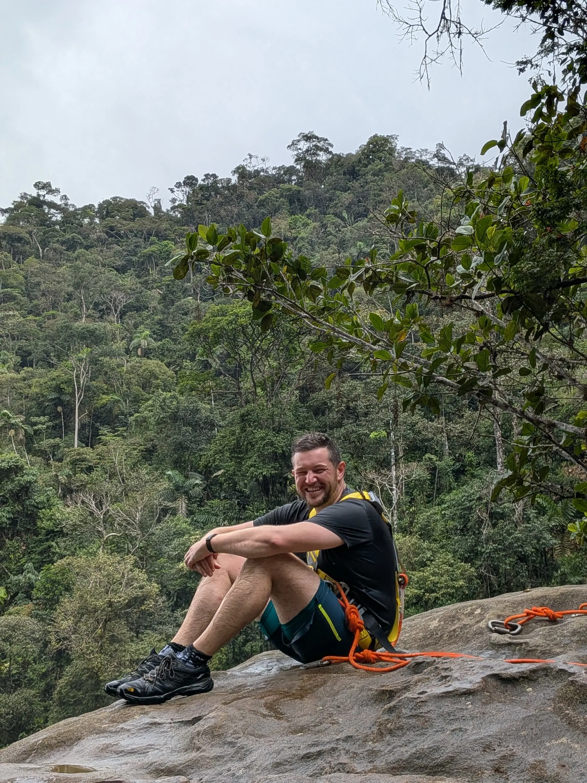Leaning over the edge of Fin del Mundo, harness-protected
