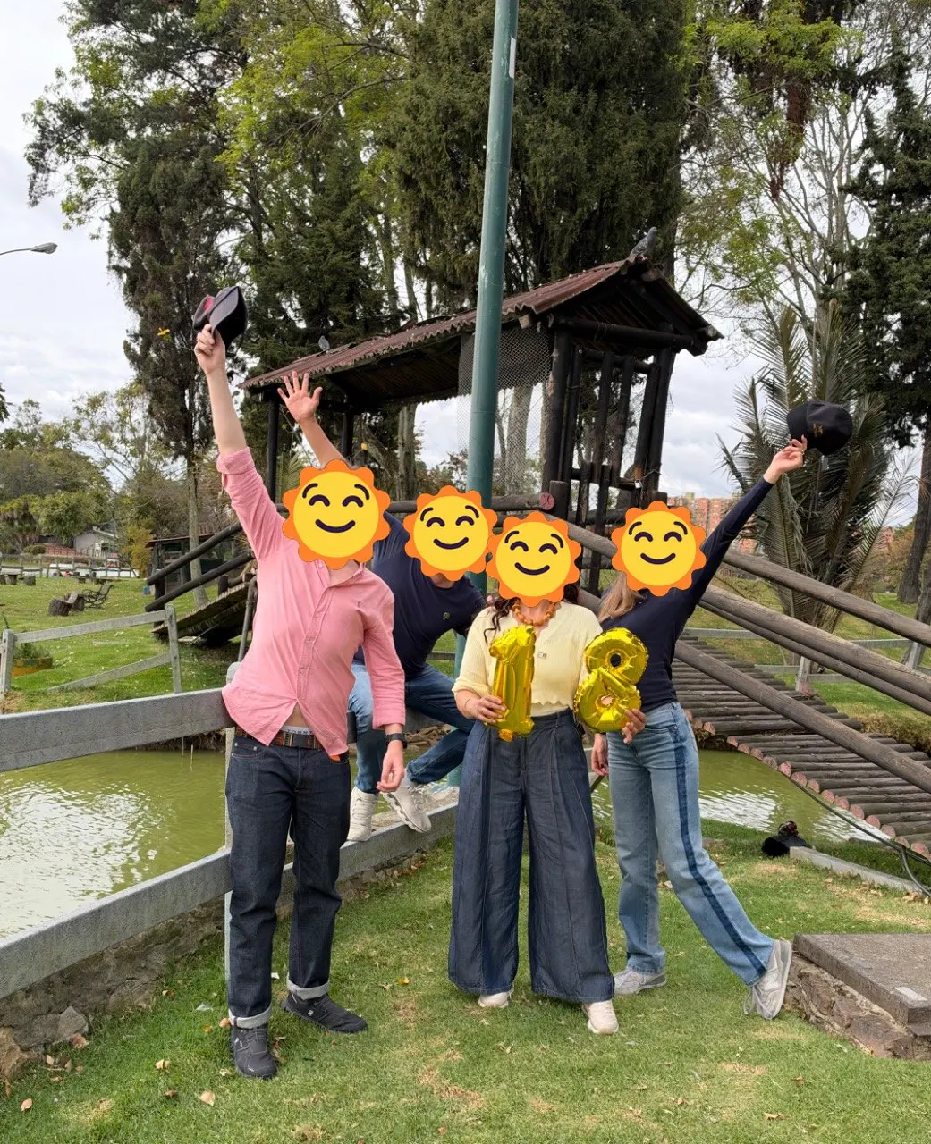 Los muiscas insurgentes posing on the bridge at Parque de Los Novios with 18 balloons